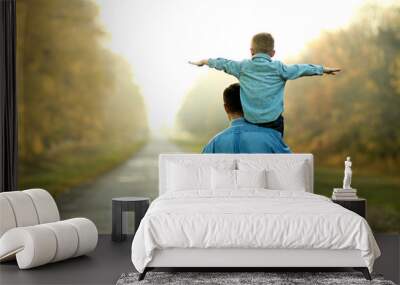 father and son walk in nature Wall mural