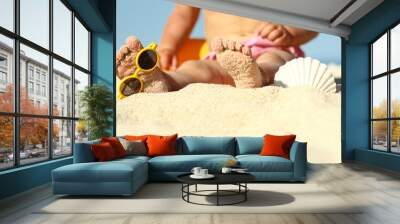 Legs of a child on the sand on the beach Wall mural