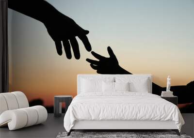 silhouette parent holds the hand of achild Wall mural