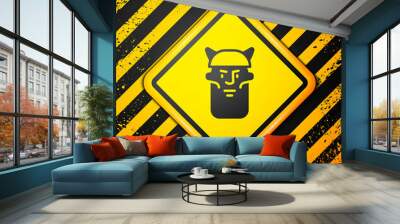 Black Viking head icon isolated on yellow background. Warning sign. Vector Wall mural