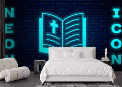 Glowing neon Holy bible book icon isolated on brick wall background. Vector Wall mural