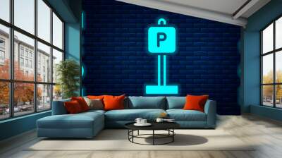 Glowing neon Parking icon isolated on brick wall background. Street road sign. Vector. Wall mural