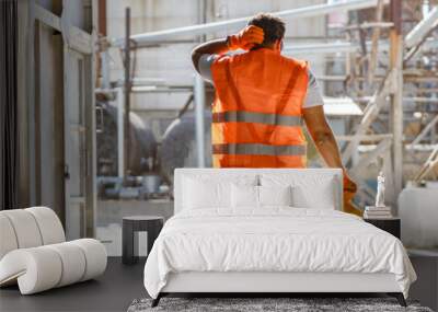 Multiracial man working hard at construction industry plant Wall mural