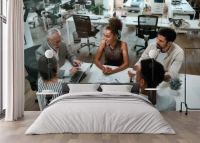 Top view of business people discussing something while working together in the modern office Wall mural