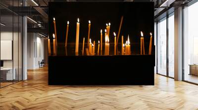 Wax candles burning with fire on background Wall mural