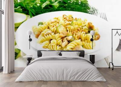 Fusilli with chicken and zucchini in two plates on board Wall mural