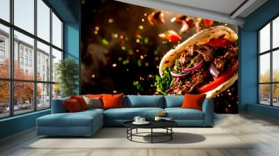 Close up of taco with meat, onions, and lettuce. Wall mural