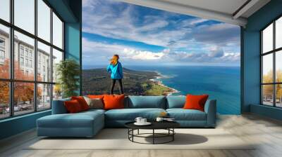 Tourist girl over Landscape of Akamas Peninsula National Park, Cyprus. Tourist resort with beaches and blue lagoons Wall mural