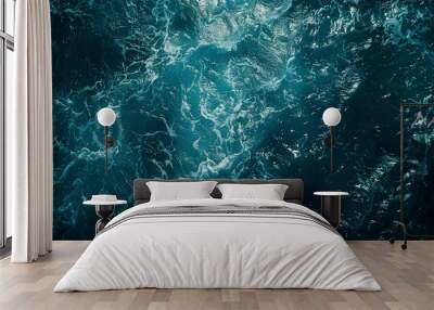 Aerial view of the dark blue ocean with textured water patterns and light reflections.  Wall mural