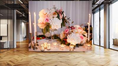 Table decor with white flowers and candles for a wedding party Wall mural