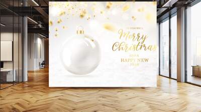 Merry christmas greeting card with lettering. Golden confetti falls on the background. Happy new year . Christmas ball. Wall mural