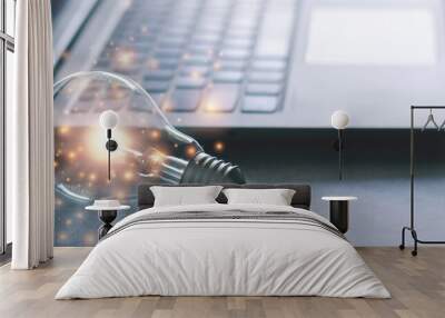 Laptop and glowing light bulb. Self learning or education knowledge and business studying concept. Idea of learning online or e-learning from home. Wall mural