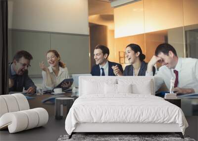 Business people laughing in conference room meeting Wall mural