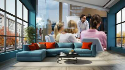 Businessman leading meeting in conference room Wall mural