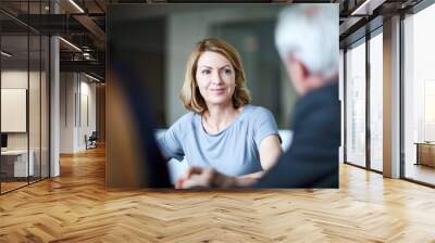 Businesswoman listening to businessman in meeting Wall mural