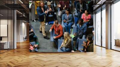 Conference audience watching speakers on stage Wall mural