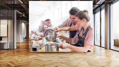 Couple enjoying cooking class in kitchen Wall mural