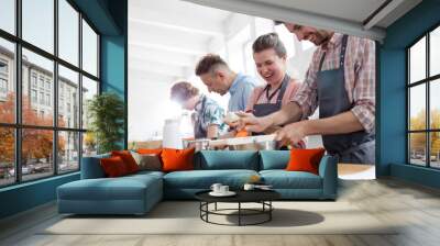 Couple enjoying cooking class in kitchen Wall mural