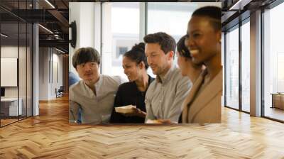 Happy business people enjoying sushi lunch Wall mural