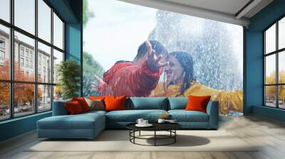 Happy couple dancing in rain Wall mural