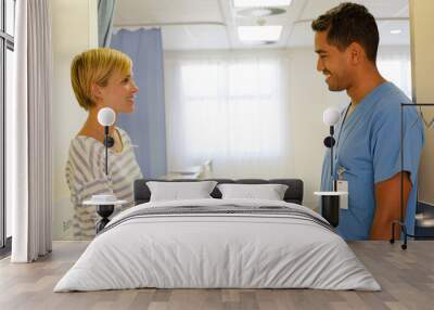 Patient giving nurse gift in hospital Wall mural