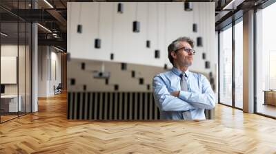 Pensive businessman looking away Wall mural