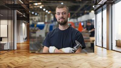 Portrait confident worker in steel factory Wall mural