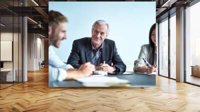 Portrait smiling senior businessman in meeting Wall mural