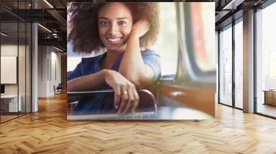 Portrait smiling woman riding bus Wall mural