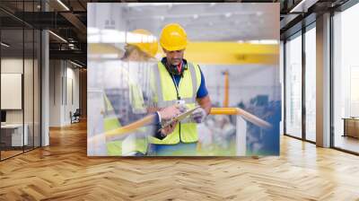 Supervisor and worker talking in steel factory Wall mural