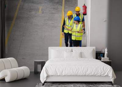 Supervisor and workers talking in factory Wall mural