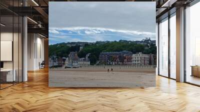 Panoramic view of Trouville coastline with typical norman architecture luxury buildings along the sandy beach. Famous resort and fishermen village in Normandy. Wall mural