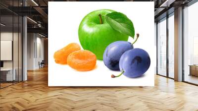 Green cooking apple, dry apricots and fresh plums isolated on white background Wall mural