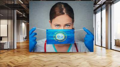 Coronavirus in U.S. State South Dakota, Female Doctor Portrait, protect Face surgical medical mask with South Dakota Flag. Illness, Virus Covid-19 in South Dakota Wall mural