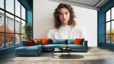 Close up portrait of young pretty brunette lady with wavy hair and tender glance looking on camera. Non-existent person. Generative Ai Wall mural