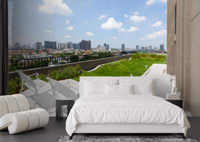 Green garden and white table on view city Wall mural