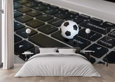 Football ball, soccer ball, on laptop keyboard, 3d rendering Wall mural