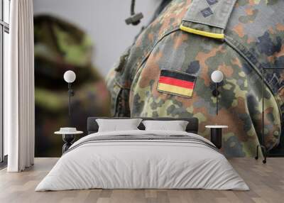 Uniform of the German army with the German flag on the shoulder. German military, selective focus. Wall mural