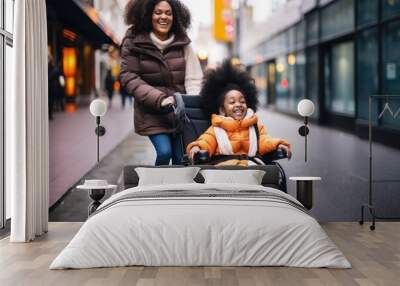 African american mother with her disabled child daughter on wheelchair happy walking city center Wall mural