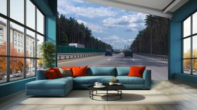 Highway wide road in the city, transport and blue sky with clouds on a summer day Wall mural