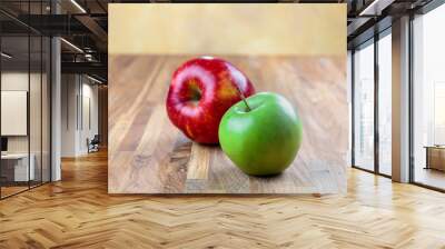 two ripe apples lie on the oak surface of the table Wall mural