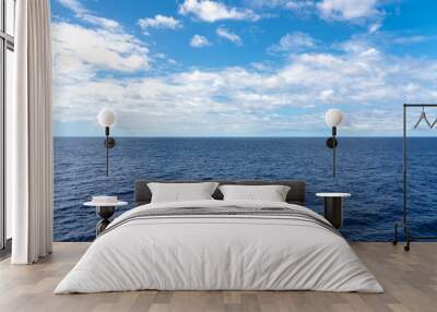 Atlantic Ocean Seascape with blue ocean and a sky filled with clouds  Wall mural