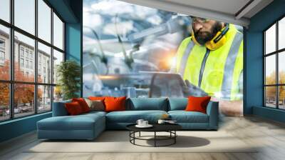 Manager or Industrial engineer working and control robotic with industry factory and network connection automation robot arm by tablet. AI, Artificial intelligence. Wall mural