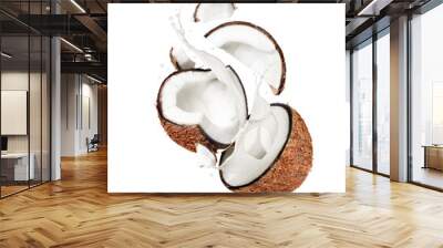 Coconut broken into two halves in the air with splashes of milk Wall mural