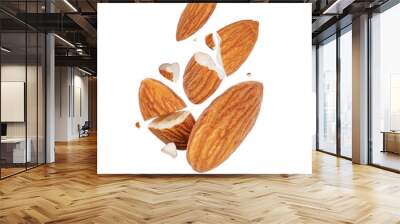 Cracked almonds close-up in the air on a white background Wall mural