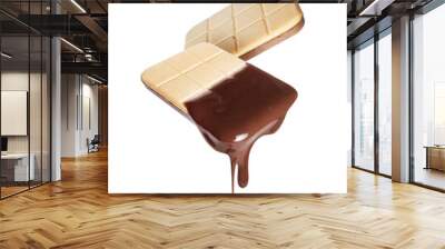 Melted chocolate dripping from crispy biscuits on a transparent background Wall mural