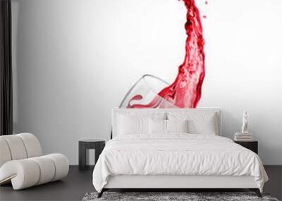 Red wine splashes from a glass on a white background Wall mural