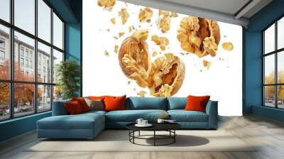 Walnuts torn into pieces in the air isolated on white background Wall mural