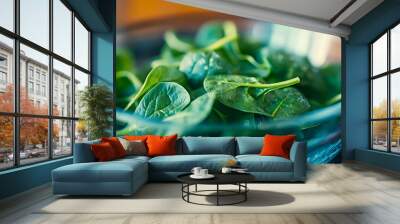 close-up of spinach leaves in a glass bowl, ready to be used in a nutritious Wall mural