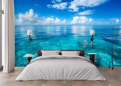 Shimmering tropical sea surface, with calm, transparent waters that reveal coral below Wall mural